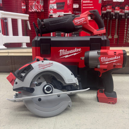 Power ToolsRed Milwaukee power tools displayed on a shop floor include a circular saw, impact wrench, and reciprocating saw, conveying a professional tone.